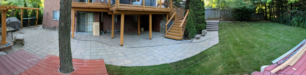 interlock pavers patio stones with sod grass installed in the front yard